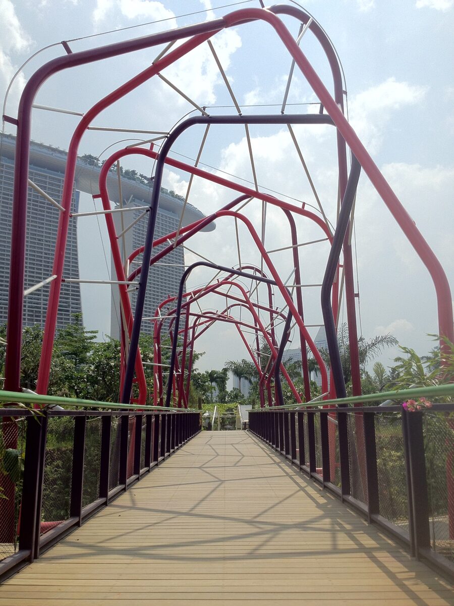 Boardwalk toward the water and the conservatories. Photograph via Wikimedia Commons.